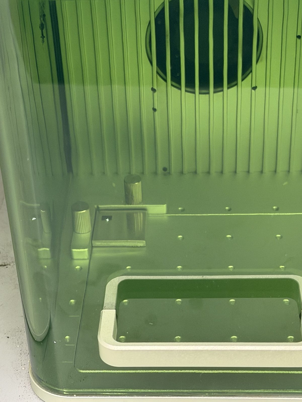 Inside the xTool F1 enclosure with a coupon fixtured against alignment pins