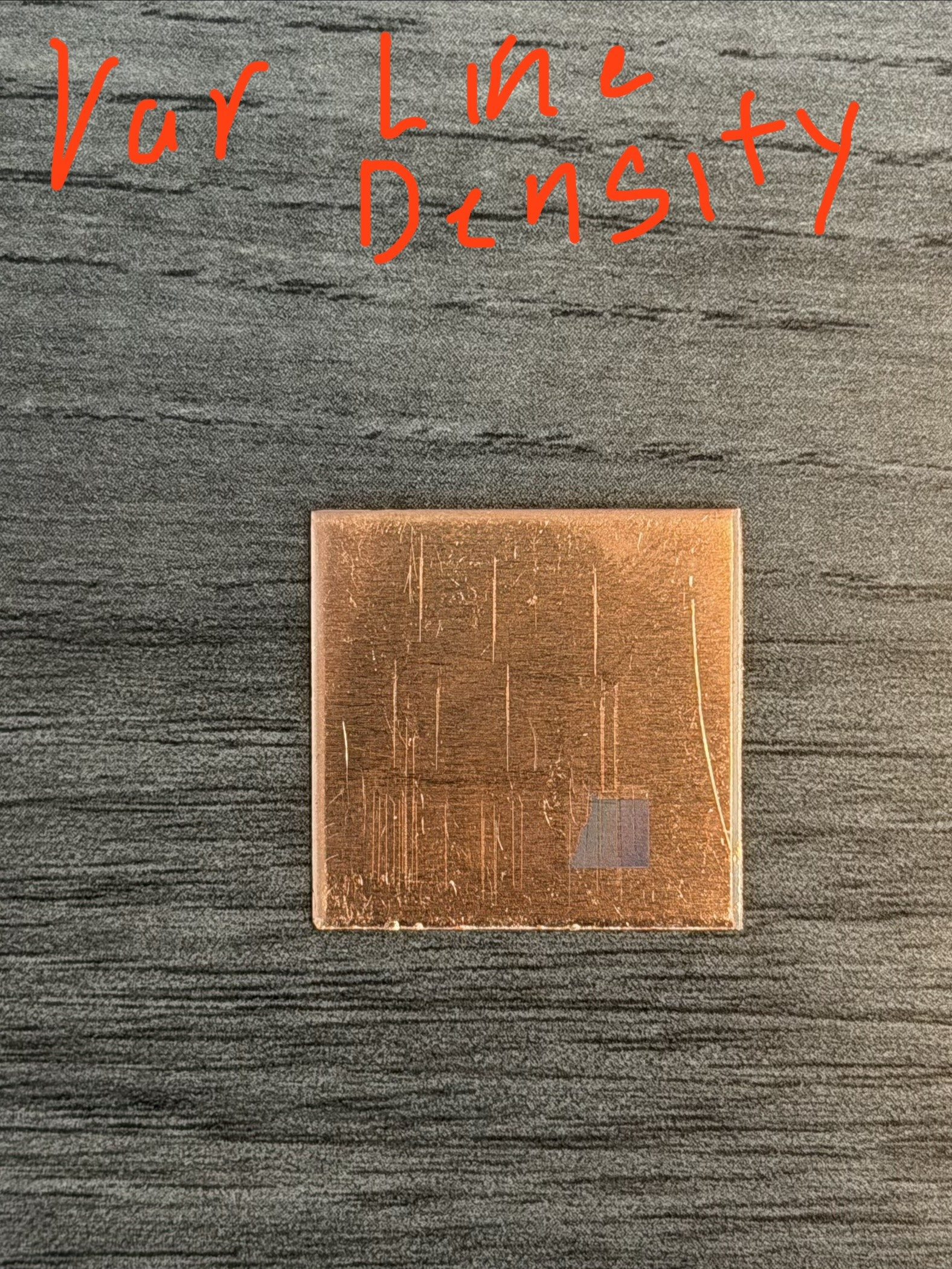 Copper coupon with faint laser squares