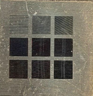 Titanium coupon with nine darkened squares